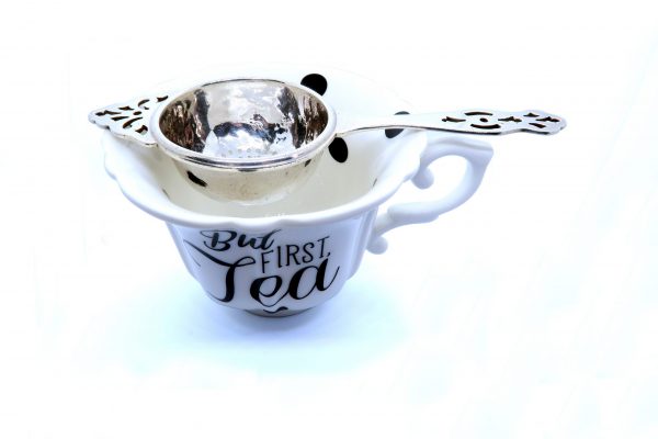 Vintage Silver Tea Strainer sat in cup