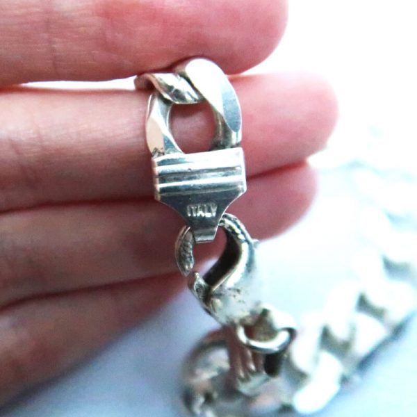 Vintage Men's Silver Bracelet held between fingers showing Italy mark