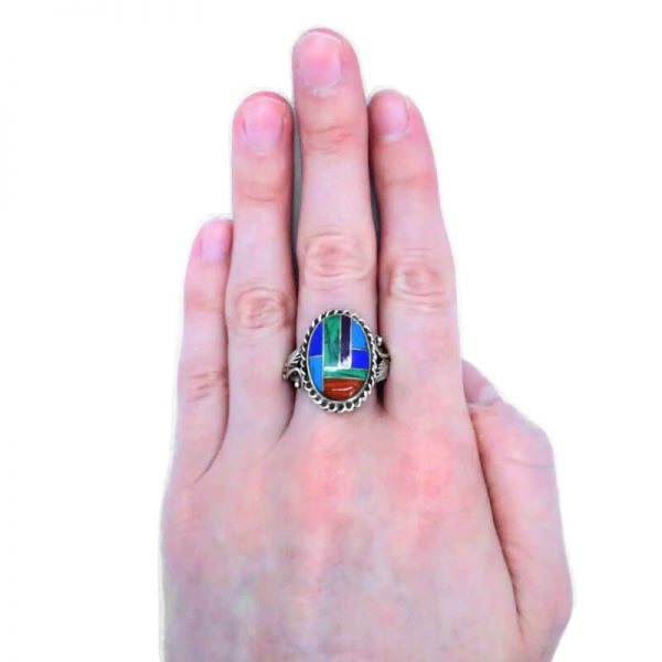 Vintage silver and semi precious stone set ring on middle finger