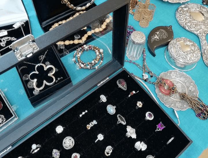 silver rings and other jewellery displayed at flitwick antiques and collectors fair