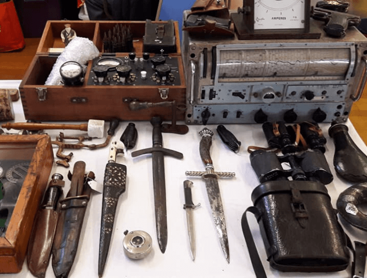 knives, binoculars and other militaria displayed at flitwick antiques and collectors fair