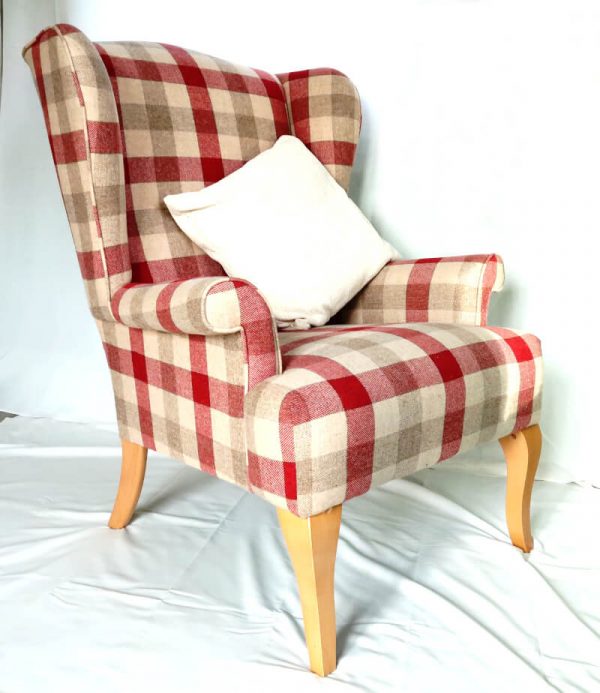 Wing back chair - vintage style angled side view of chair with white pillow