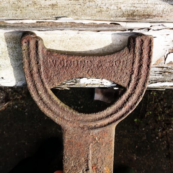 Antique Boot Scraper W Cross & Sons. close up of writing